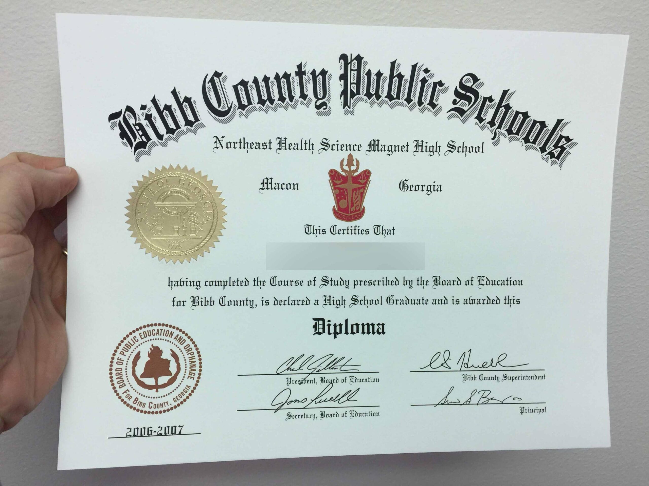 Example of a realistic high school diploma replica with raised seal and watermark